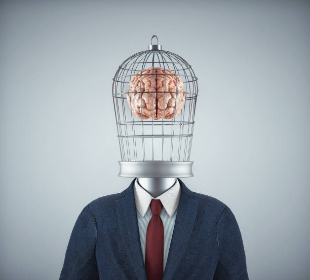 istock Businessman with a bird cage head with a brain inside. 1421791684