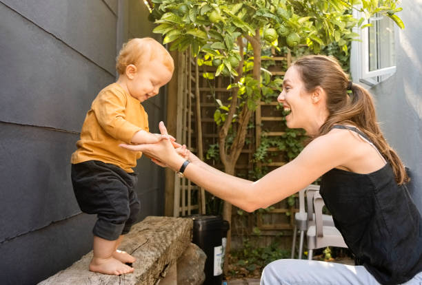 istock Cute boy having fun with his mother in backyard 1421795446