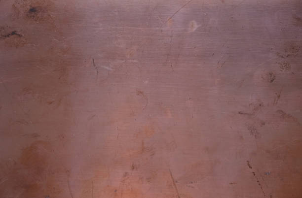 istock Textolite with copper foil. Copper background. Fingerprints on the surface. 1421795574