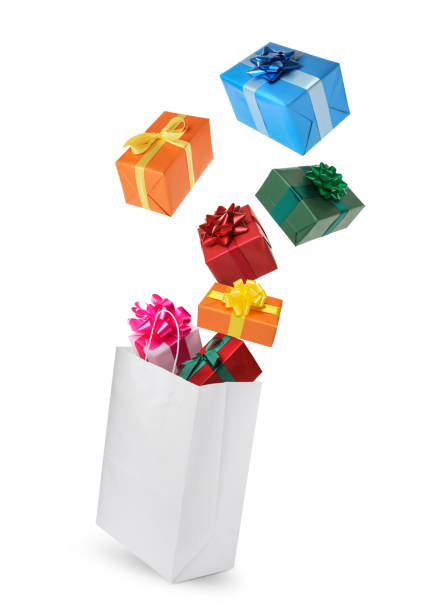 istock Many different gift boxes falling into paper shopping bag on white background 1421796625