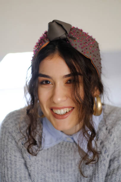 istock Young woman smiling portrait 1421800525