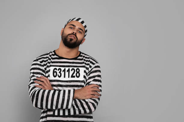 istock Prisoner in special uniform on grey background, space for text 1421802915