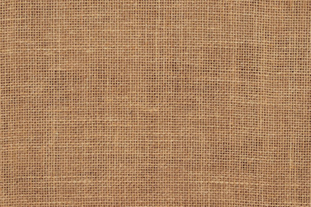 istock Brown burlap cloth background or sack cloth for packing. Natural linen threads texture. Sackcloth, empty space. Wrapping detail, old grainy cotton backdrop close-up. 1421804535
