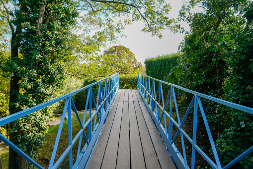Bridge wooden walkway with blue metal protection