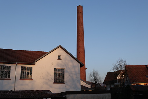 Smoke stacks on the roof of a house