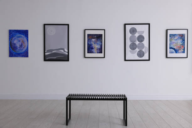 istock Bench and beautiful paintings in art gallery 1421809941