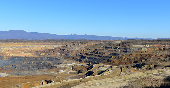 Panorama of ore mining and processing enterprise. Large mining machines that dig up raw ore.