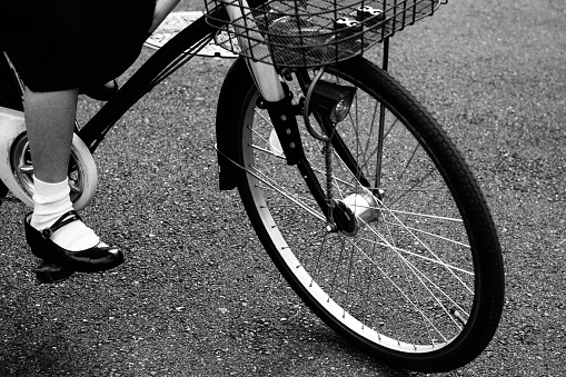 Feet image of a girl riding a bicycle