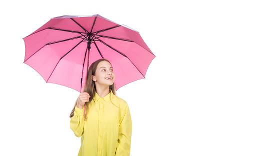 happy teen girl under pink umbrella in autumn weather isolated on white copy space, autumn.