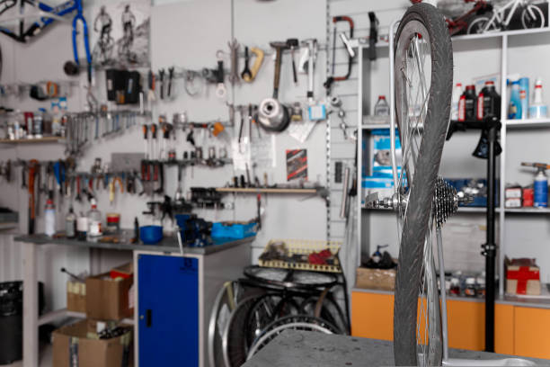 istock In foreground on the rack in the garage workshop is a deformed bicycle wheel 1421815109