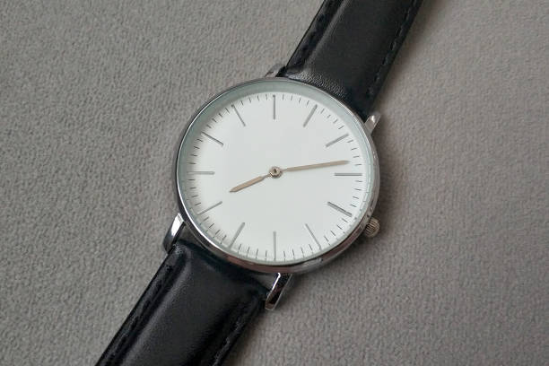 istock Wristwatch on gray background. Time concept. 1421815250