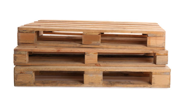 istock Stacked wooden pallets isolated on white. Transportation and storage 1421817332
