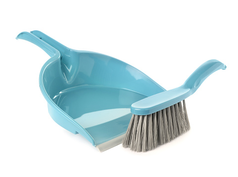 Plastic hand broom and dustpan on white background