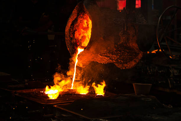 istock Pouring molten steel from the ladle into a mold in a casting unit 1421819680