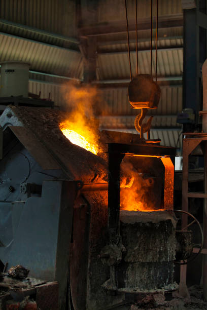 istock Pouring molten steel from the ladle into a mold in a casting unit 1421819736