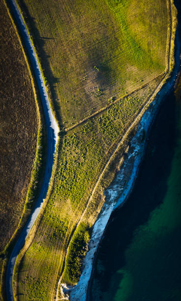 istock Road in landscape near beach 1421820662
