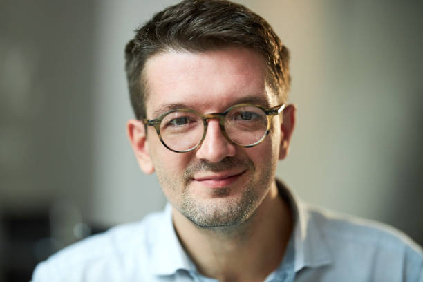 istock Portrait of smiling man. 1421828974