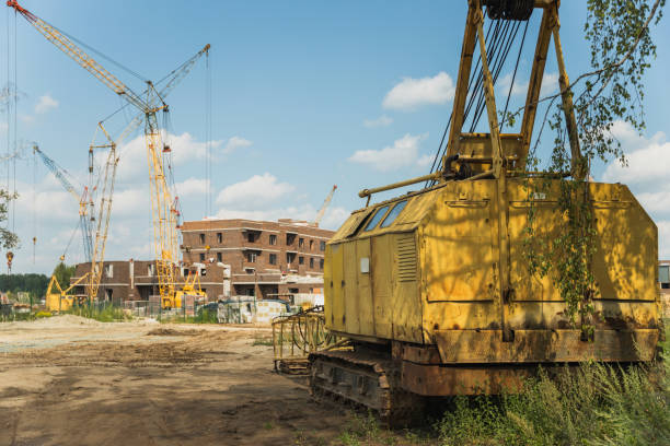 istock The disassembled old crawler crane on the background of a construction site 1421831201