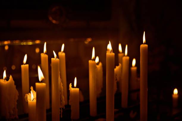 istock Close-Up Of Illuminated Candles In Temple 1421836953