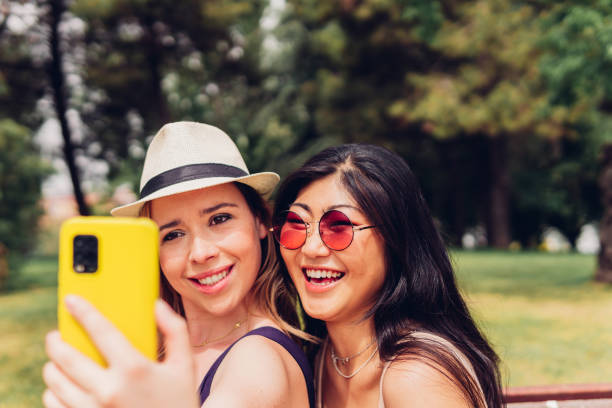 istock Happy girlfriends taking selfie on smartphone 1421837303