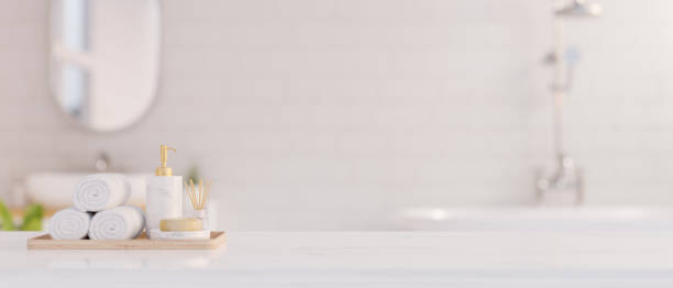 istock Elegance white marble bathroom tabletop with copy space for product display over blurred bathroom 1421837479