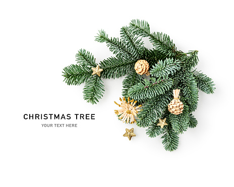 Fir tree branch with vintage decoration creative arrangement. Christmas baubles and stars isolated on white background. Flat lay, top view. Design element