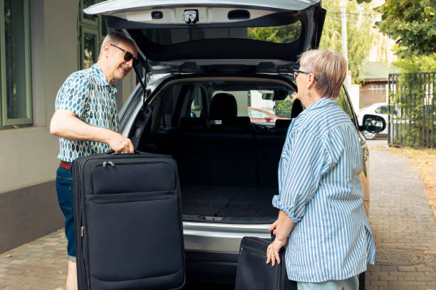 istock Retired man and woman loading luggage 1421843765