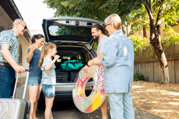 istock Happy people travelling at seaside with vehicle 1421844137