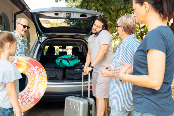 istock Big family loading baggage in automobile trunk 1421844146
