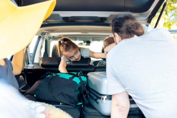istock Small child in car leaving on vacation 1421844791