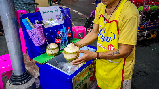 Bangkok, Thailand - September 9, 2019:  The market stall of coconut ice cream vendors at the night market in the famous Khao San road, downtown city center of Bangkok.