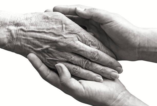 istock Young hands holding old woman hand isolated 1421849615