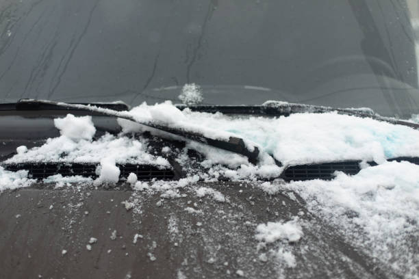 istock Snow by car. Car glass in winter. 1421851035