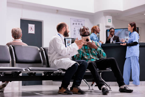 istock Injured patient with cervical collar talking to doctor 1421853281