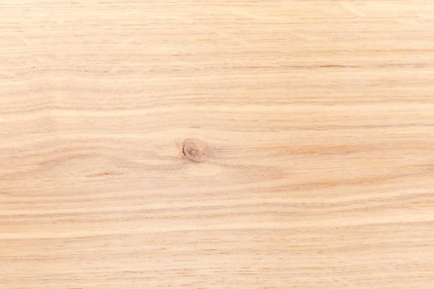 istock Texture of the light colored oak plank with small knot 1421853780