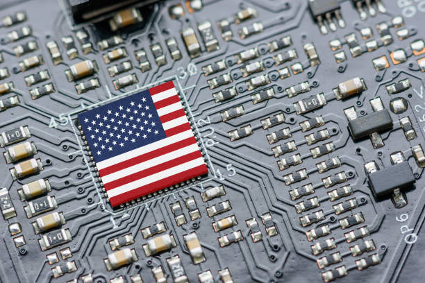 Flag of USA on a processor, CPU Central processing Unit or GPU microchip on a motherboard. US firms have become the latest collateral damage in US-China tech war. US blocks sales of AI chips to China. Flag of USA on a processor, CPU Central processing Unit or GPU microchip on a motherboard. US firms have become the latest collateral damage in US-China tech war. US blocks sales of AI chips to China. china digital flag stock pictures, royalty-free photos & images