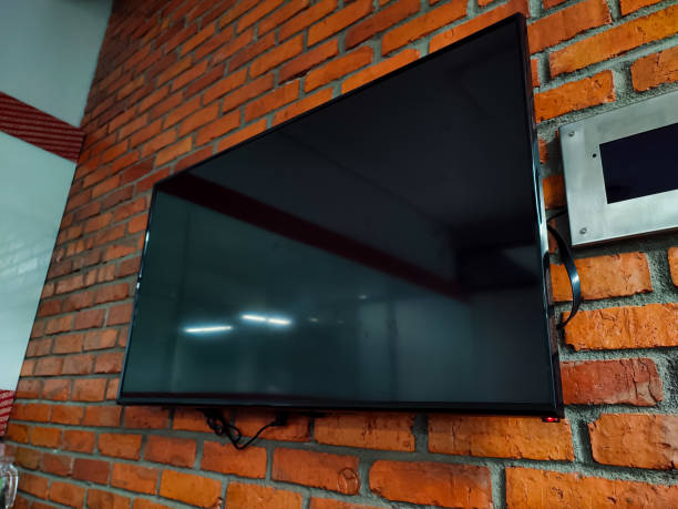 istock A big TV mounted on a brick wall 1421861487