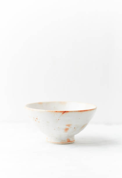 istock Traditional ceramic bowl on bright  background. Soft focus. Copy space. 1421864336