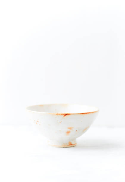 istock Traditional ceramic bowl on bright  background. Soft focus. Copy space. 1421867212