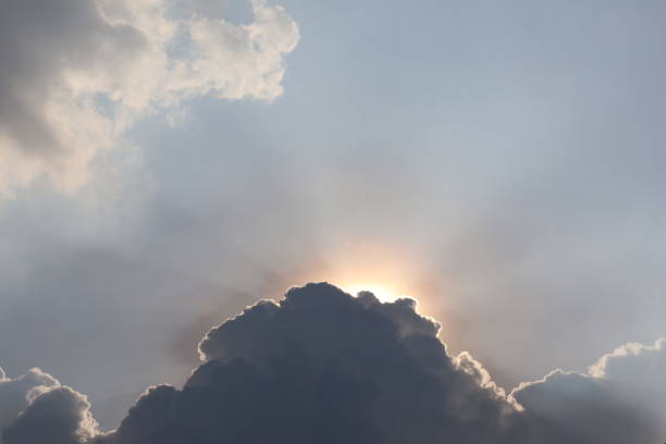 istock white clouds and sun against a background of blue sky 1421868240