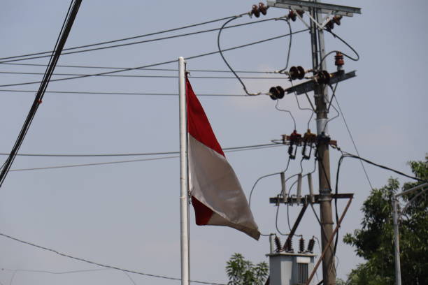 istock Indonesian red and white flag pole fluttering 1421868327