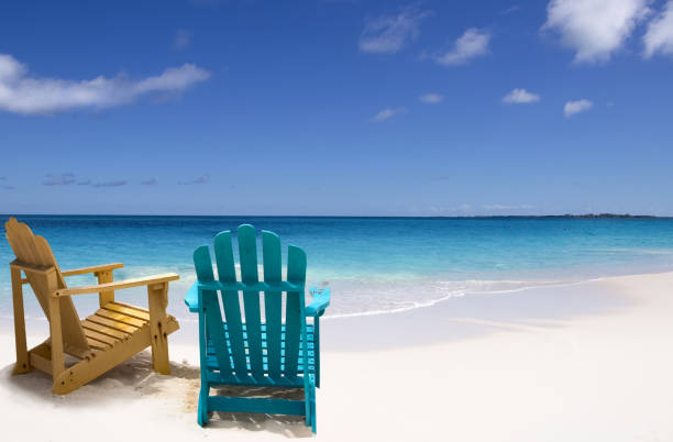 istock Beach chairs on white sand Caribbean beach 1421868678