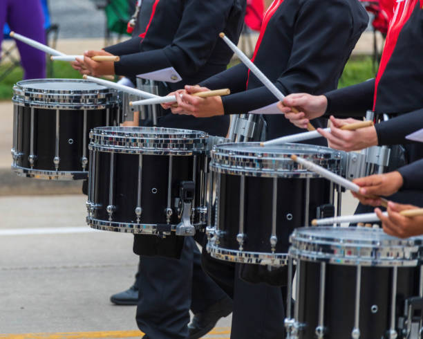 istock bass section of a marching band drum line warming up for a parade 1421878333