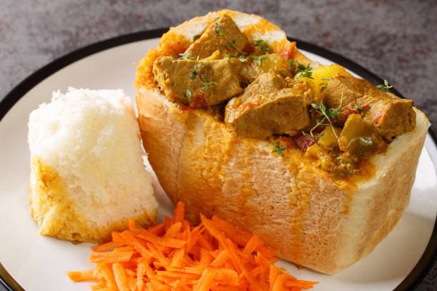 istock traditional durban mutton bunny chow closeup on plate. Horizontal 1421879367