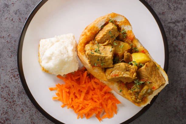 istock traditional durban mutton bunny chow closeup on plate. Horizontal top view 1421879548