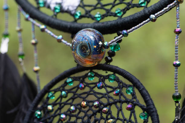 istock Handmade dream catcher with feathers threads and beads rope hanging 1421881217