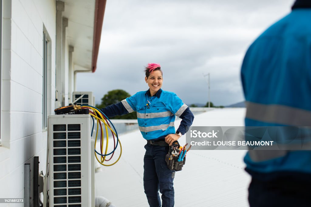 Day in the life of a female  tradie and her co-worker Lady tradie Trainee Stock Photo