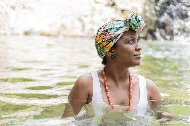 istock Woman laughing and having fun while swimming in the river. 1421882690