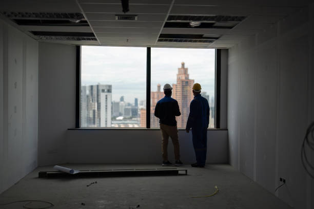 istock construction building manger visit site and meet with supervisor at the incomplete room and discuss about new tower 1421883438