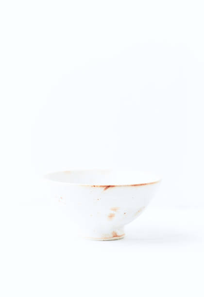 istock Traditional ceramic bowl on bright  background. Soft focus. Copy space. 1421885847